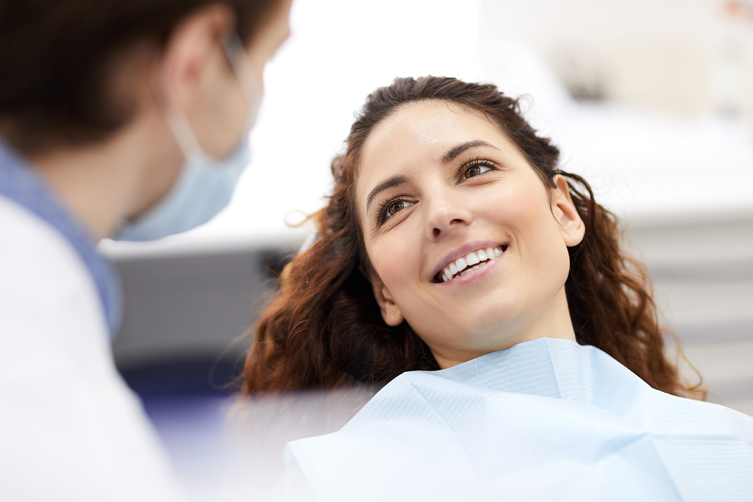 patient smiling at dental professional