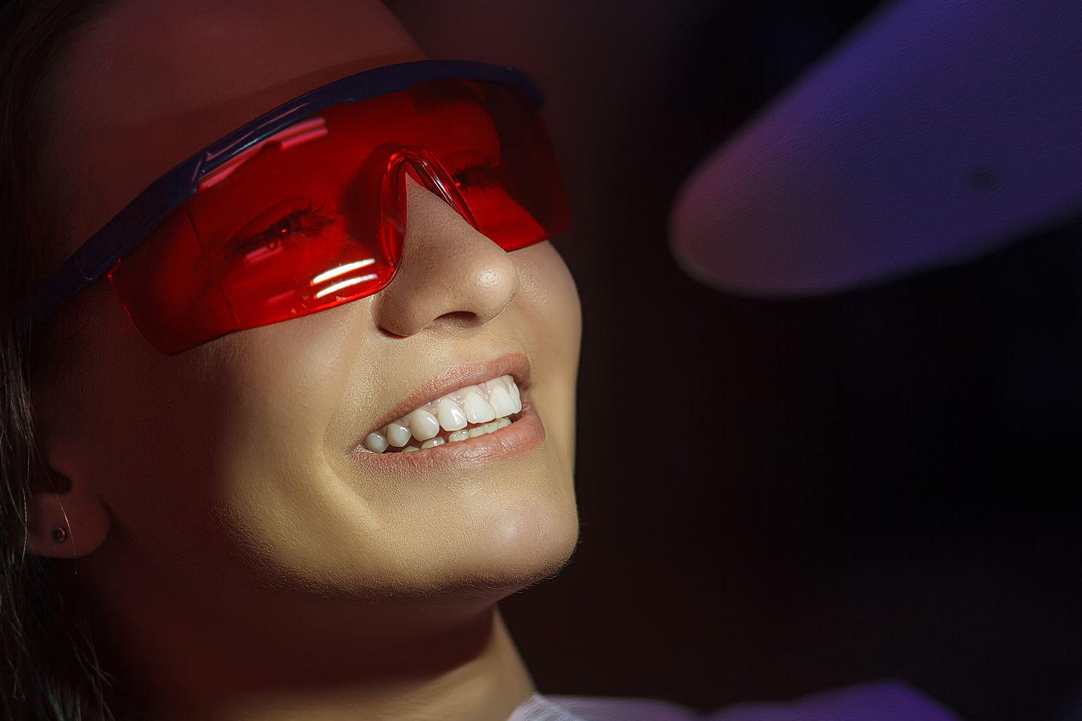 smiling woman wearing protective glasses