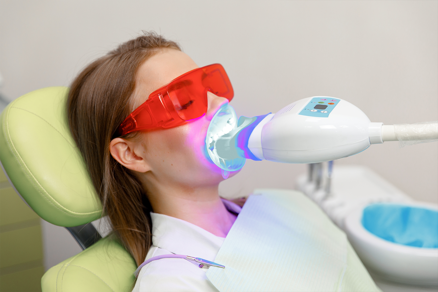 led light shining on woman's mouth