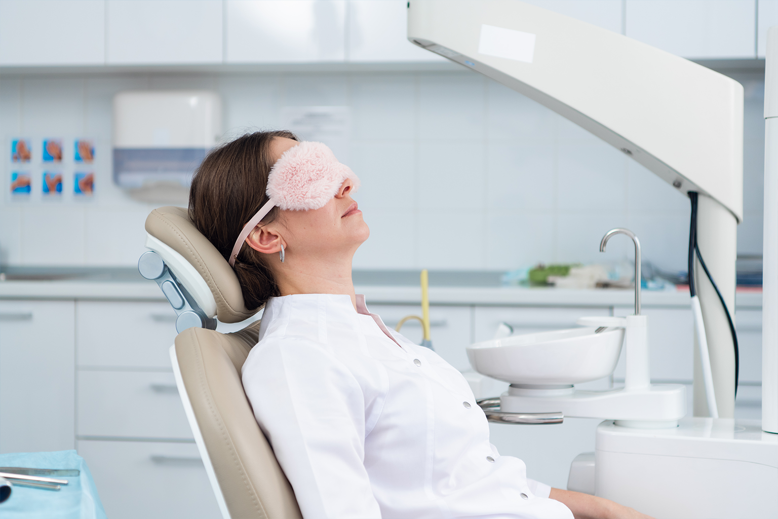 woman wearing sleep mask in dental chair