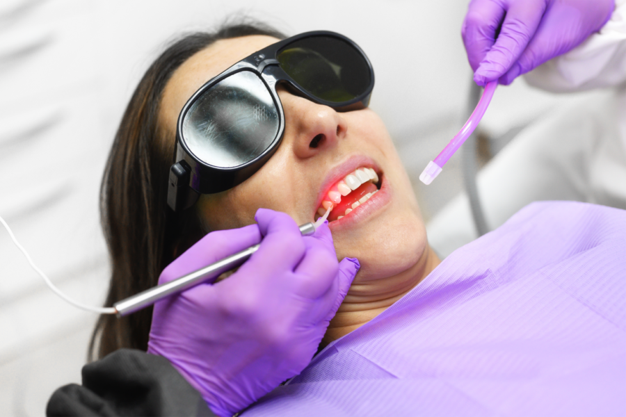 dental laser being used on teeth